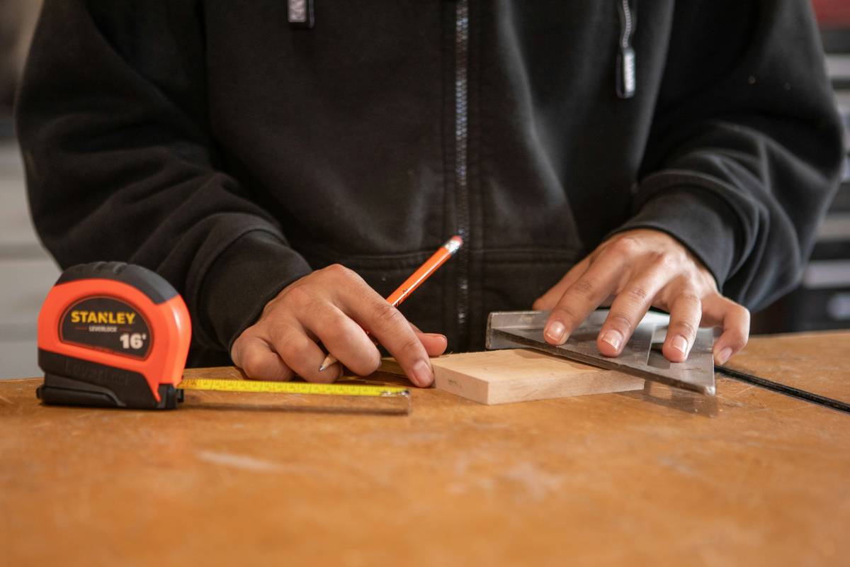 diy project scroll saw what is – close-up of a scroll saw cutting an intricate wooden snowflake pattern